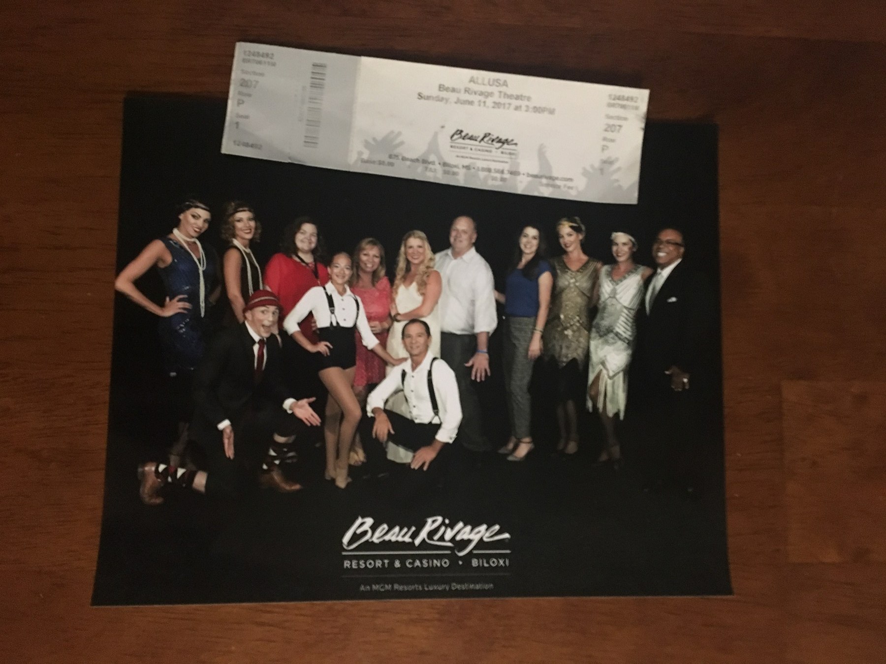 A signed ALLUSA cast poster with a ticket from the production's June 2017 run at the Beau Rivage Theatre.